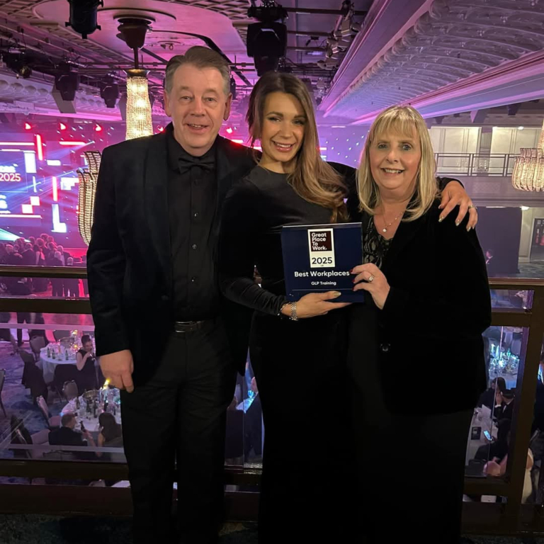 GLP Training Ranked 5th Best Place to Work in the UK - this is 3 members of the team in formal wear posing holding the award during the ceremony event.
