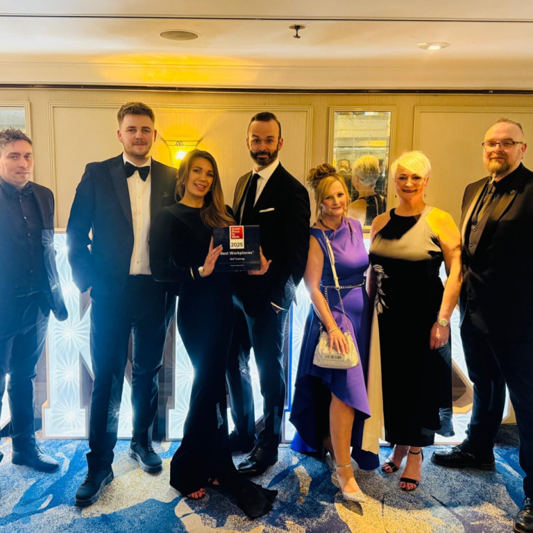 GLP Training Ranked 5th Best Place to Work in the UK - this is 7 members of the team in formal wear posing with the award at the ceremony event.
