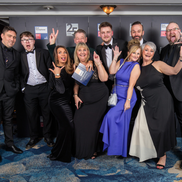 GLP Training Ranked 5th Best Place to Work in the UK - this is 10 members of the team in formal wear fun posing with the award at the ceremony event.