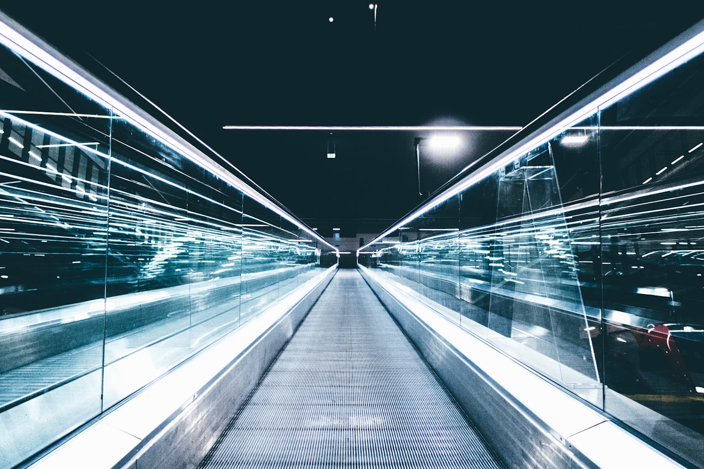 A long shot of a travelator that appears to moving quickly due to the lighting of the image