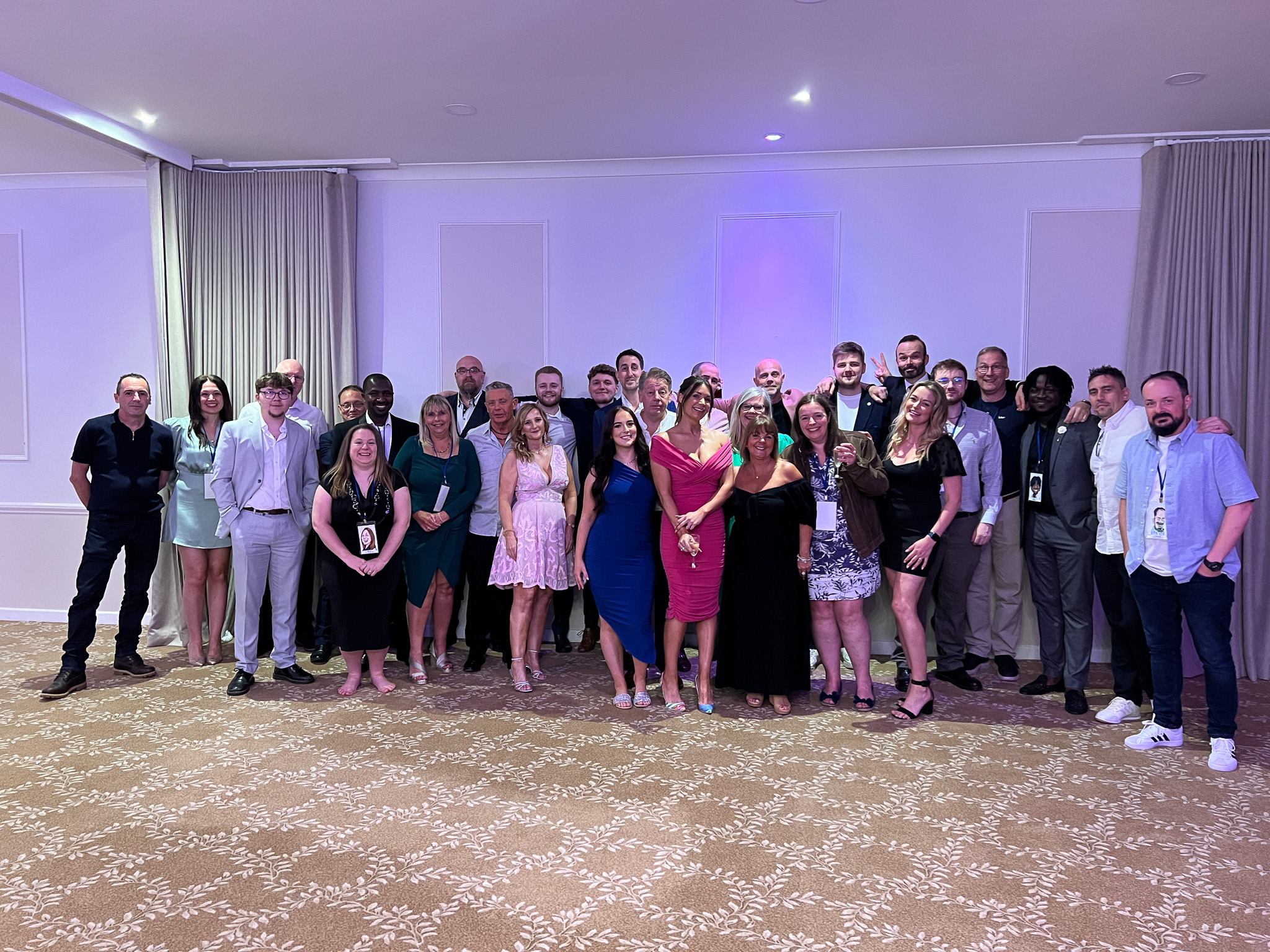 GLP Training's team in formal wear at an award ceremony posing for the camera