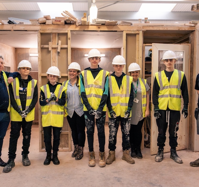 Tudor Grange Learners and 2 GLP Training Staff, in construction learning setting
